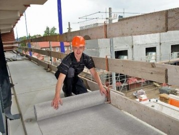 Employee laying down our new TecDura product